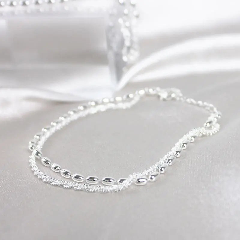 Set of elegant silver bracelets with cubic zirconia stones