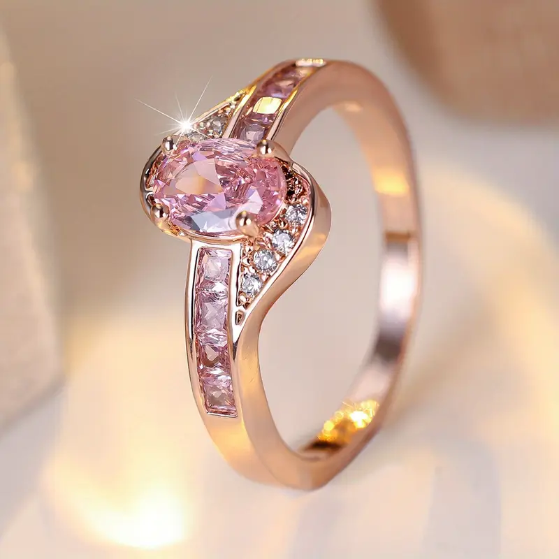 Golden ring with a pink crystal