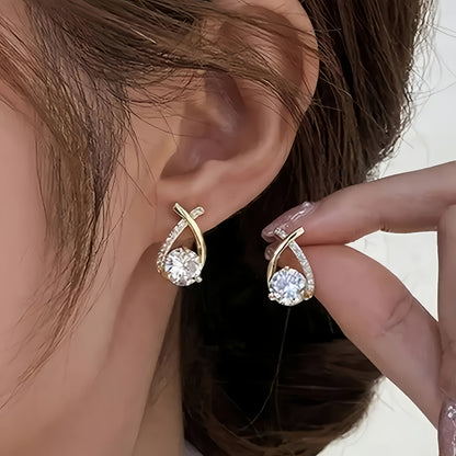 Earrings with golden cross and zircons