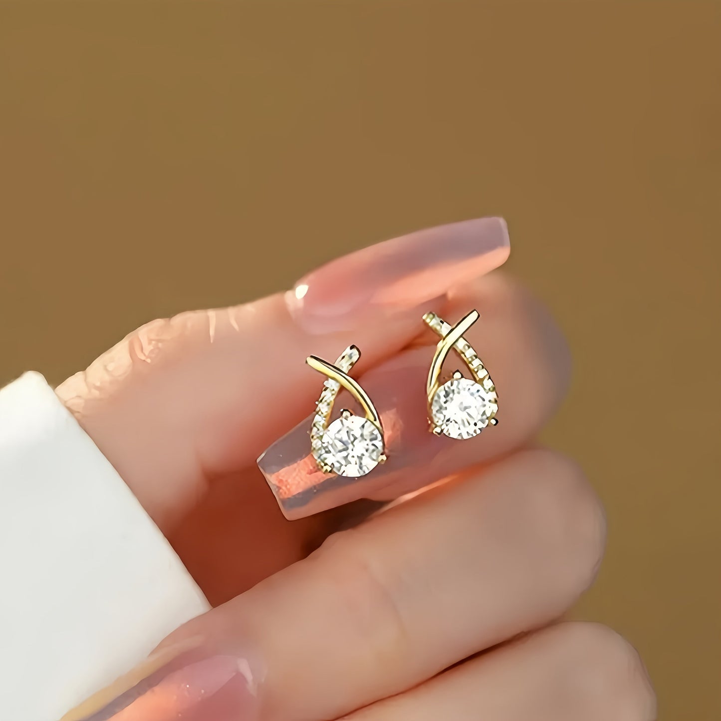 Earrings with golden cross and zircons