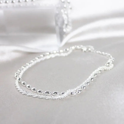 Set of elegant silver bracelets with cubic zirconia stones