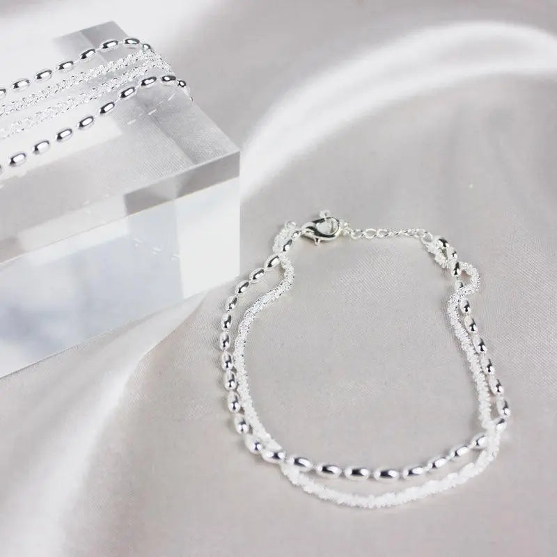 Set of elegant silver bracelets with cubic zirconia stones
