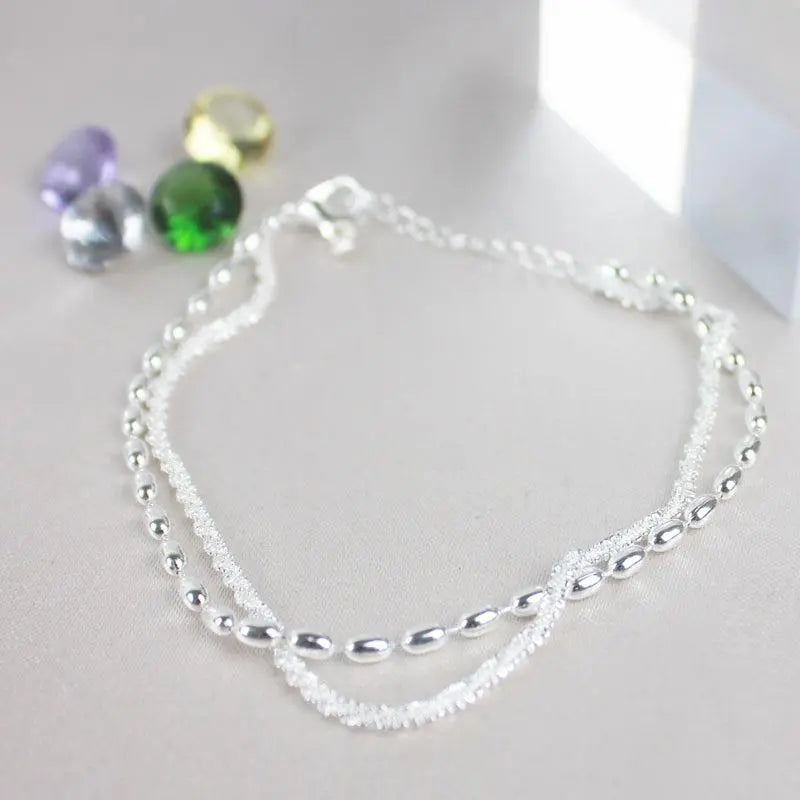 Set of elegant silver bracelets with cubic zirconia stones