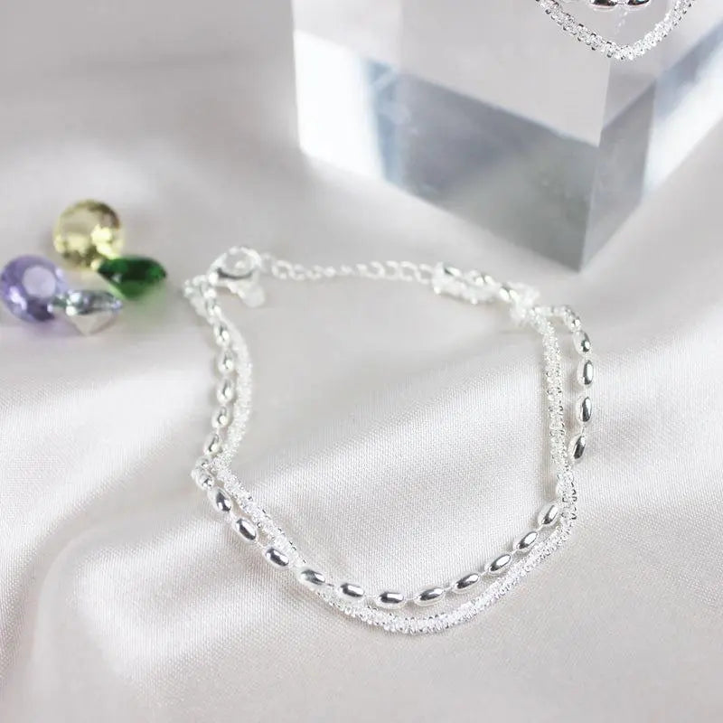 Set of elegant silver bracelets with cubic zirconia stones