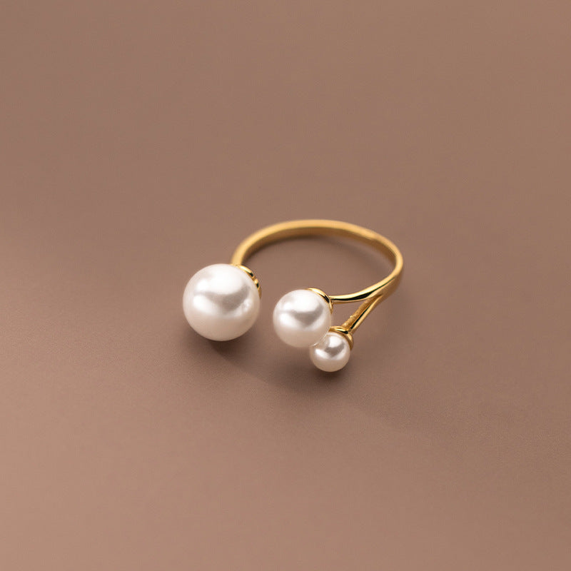Elegant Ring with Trio of Pearls