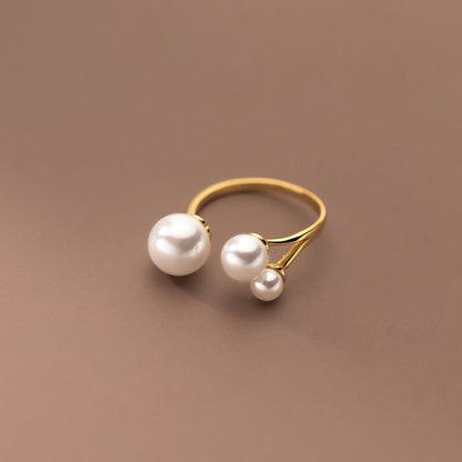 Elegant Ring with Trio of Pearls
