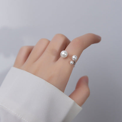 Elegant Ring with Trio of Pearls