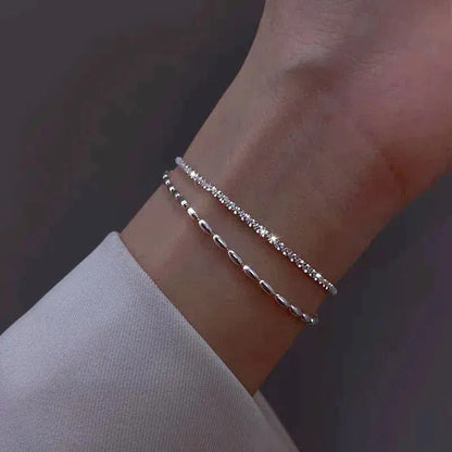 Set of elegant silver bracelets with cubic zirconia stones