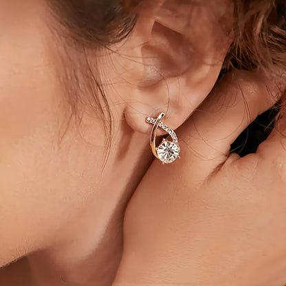 Earrings with golden cross and zircons