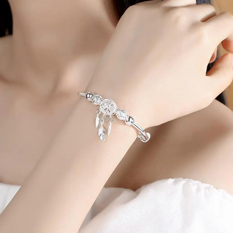 Silver bracelet with dreamcatcher pendant