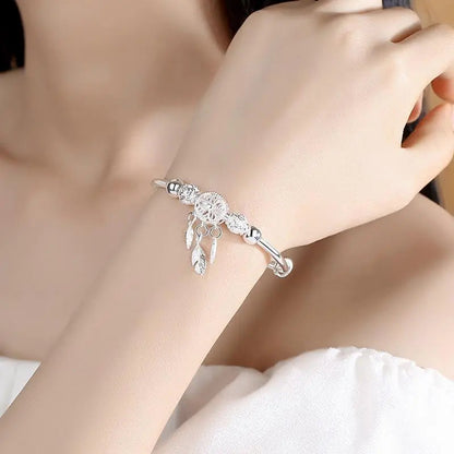Silver bracelet with dreamcatcher pendant